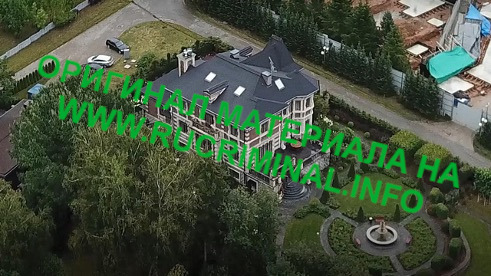 A large house surrounded by treesDescription automatically generated